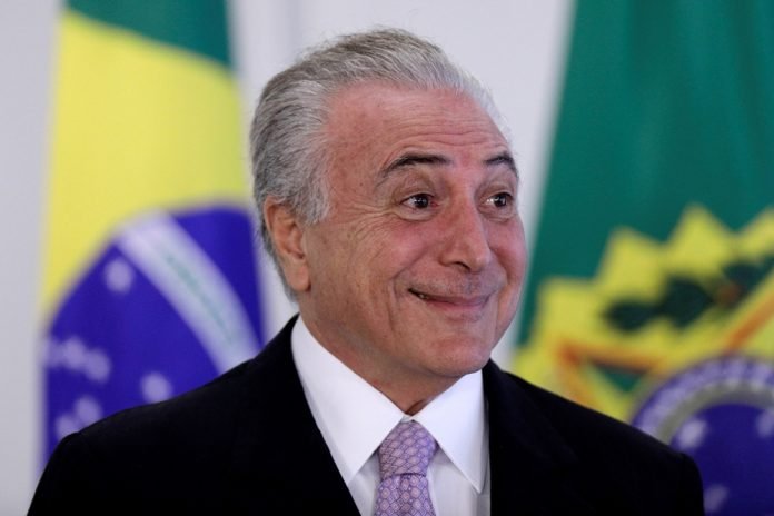 Brazil's President Michel Temer smiles during a signing ceremony of the New Decree of Port Regularization, at the Planalto Palace in Brasilia